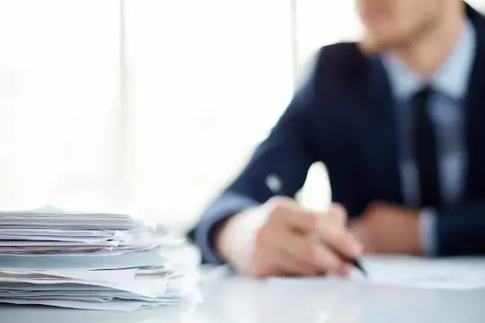 close-up-pile-papers-table